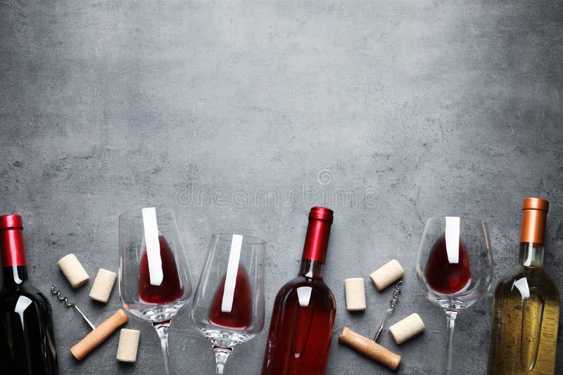 Flat lay composition with different wines on grey background royalty free stock photo