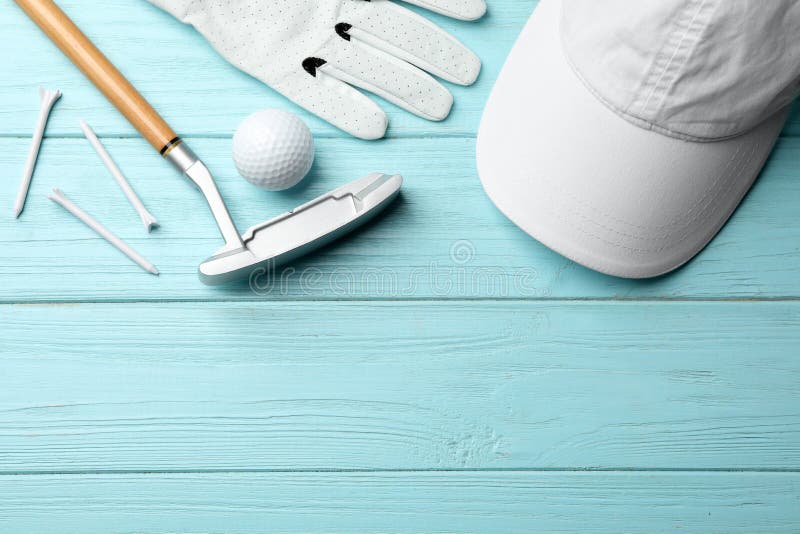 Flat Lay Composition with Golf Accessories on Blue Wooden Background