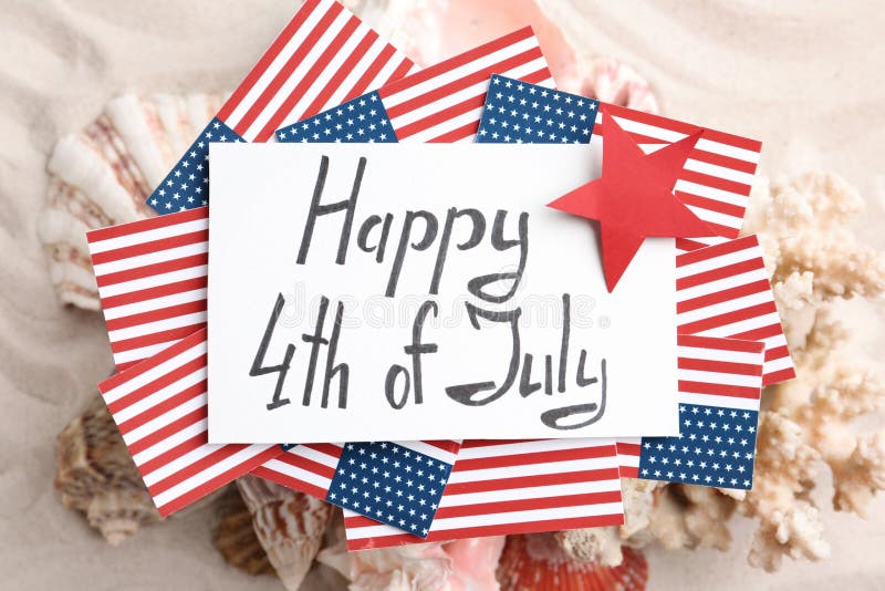 Flat Lay Composition With Greeting Card, USA Flags And Seashells. Happy