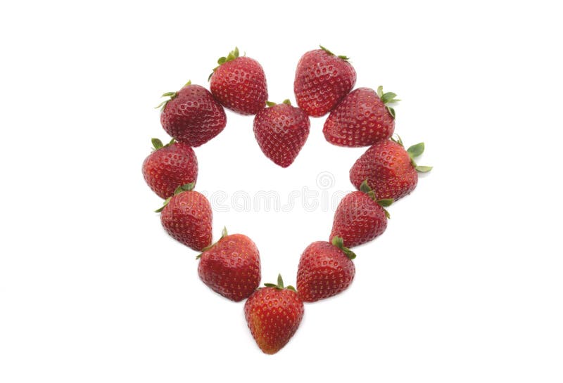 Flat lay composition in hart shape with fresh red strawberries isolated on white background. Flat lay pattern, top view