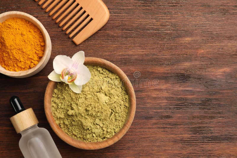 Flat Lay Composition with Henna and Turmeric Powder on Wooden Table