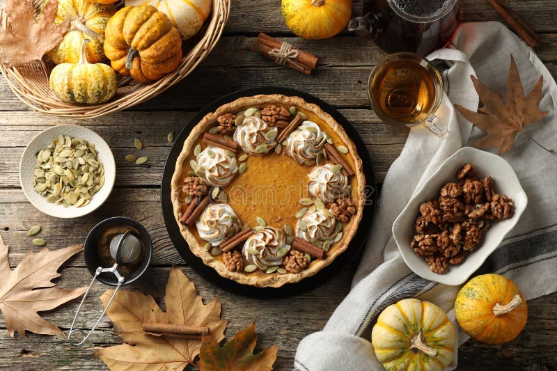 Flat lay composition with homemade pumpkin pie on wooden table stock photo