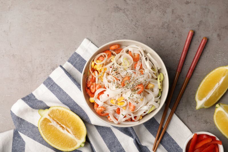 Flat Lay Composition with Rice Noodles in Bowl on Grey Stock Photo