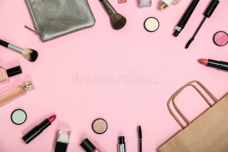 Horizontal wide makeup products with bag pink background