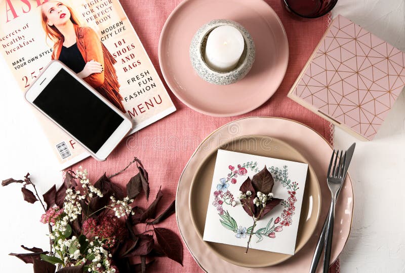 Flat lay composition with tableware, mobile phone, floral decor and magazine on color background royalty free stock photography Flat lay composition with tableware, mobile phone, floral decor and magazine on color background royalty free stock photography