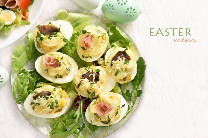 Flat lay of Easter table with deviled eggs and menu space on right for own text stock photography