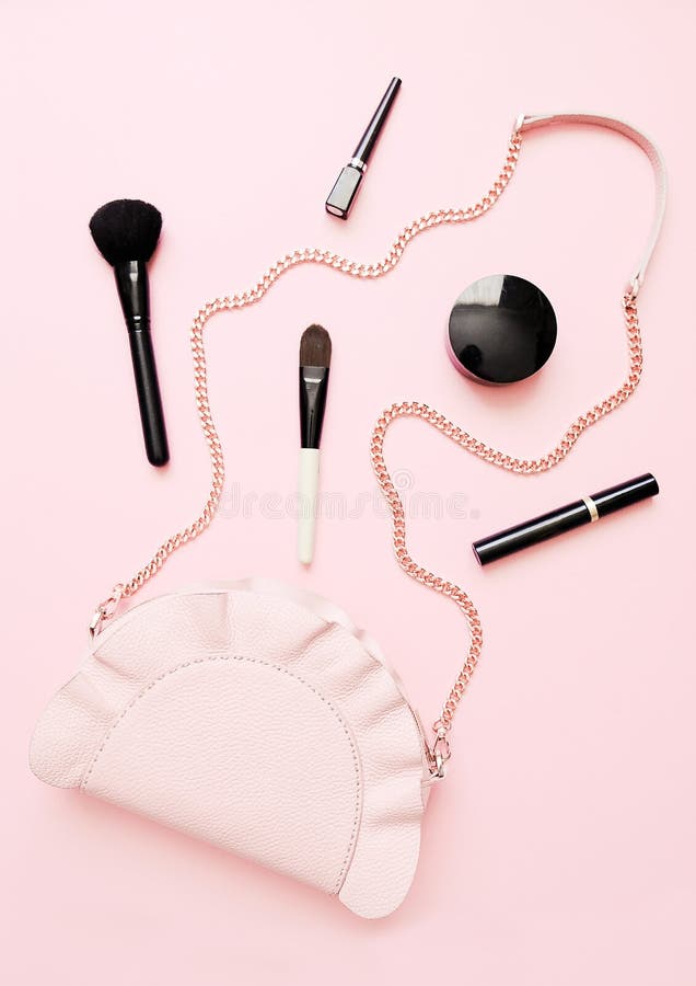 Flat lay of female fashion accessories, makeup products and handbag on pastel color background. Beauty and fashion concept. royalty free stock photo Flat lay of female fashion accessories, makeup products and handbag on pastel color background. Beauty and fashion concept. royalty free stock photo