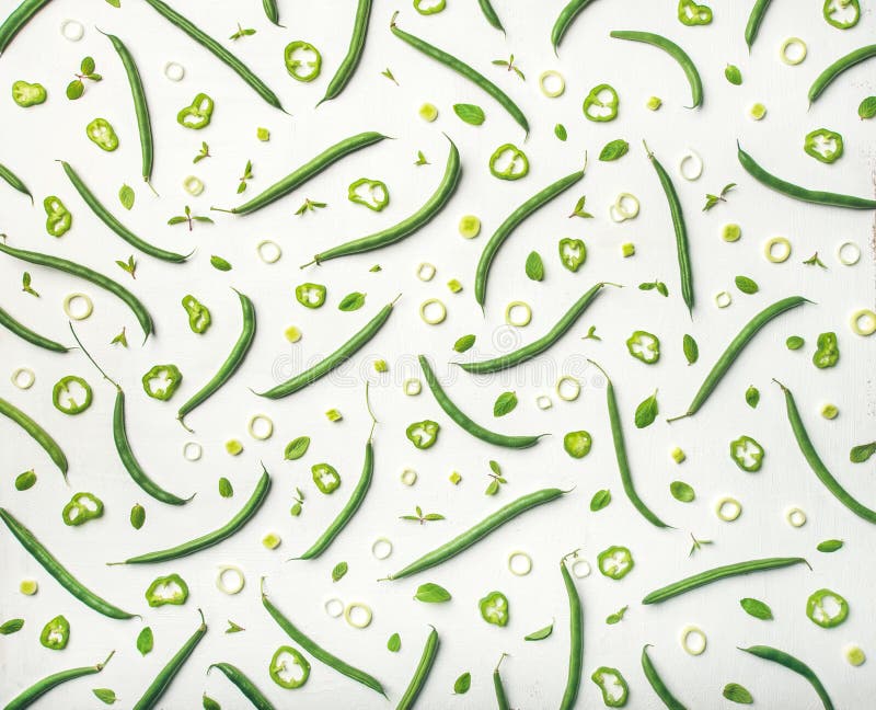 Flat-lay of fresh green beans over white background