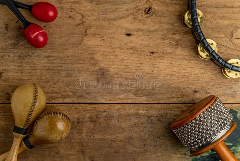 Flat lay of Latin percussion on wood desk