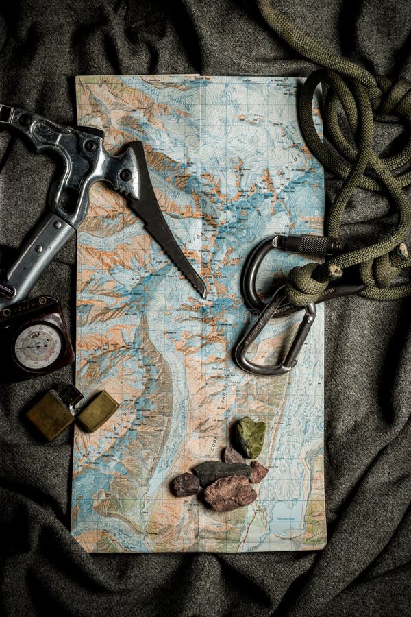 Flat Lay of Map and Equipment Needed for Expedition into the Mountains