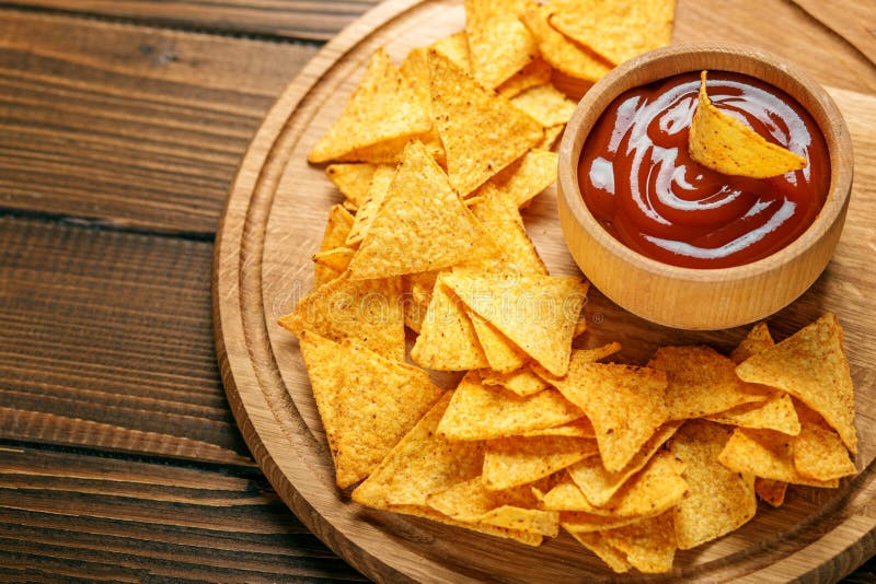 Flat Lay. Mexican Nachos Chips with a Sharp Tomato Sauce on the Stock