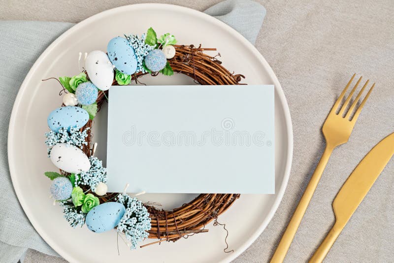 Flat lay with mockup menu and easter decoration. Easter wreath and blank card