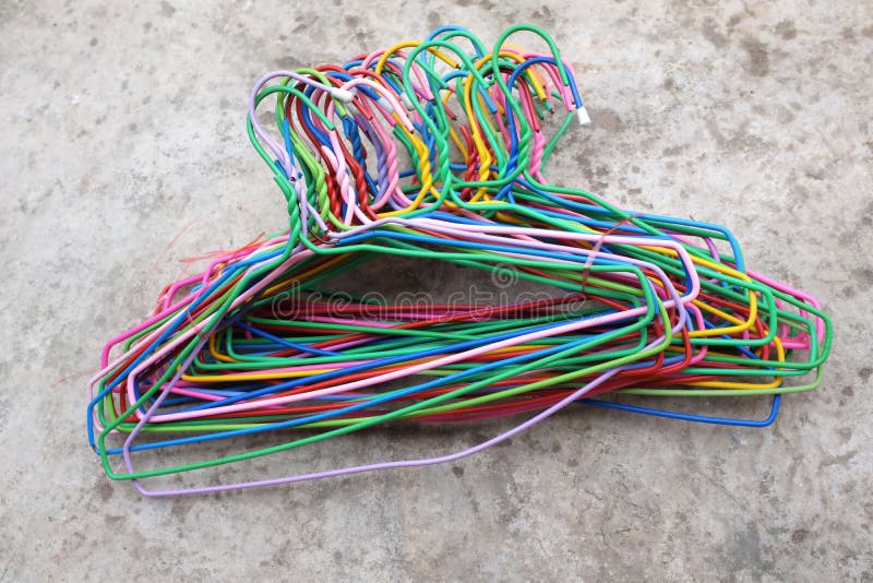 Multi Color of Steel Clothes Plastic Coated Wire Hangers Hanger on Cement  Floor Stock Image - Image of cement, cloth: 209356227