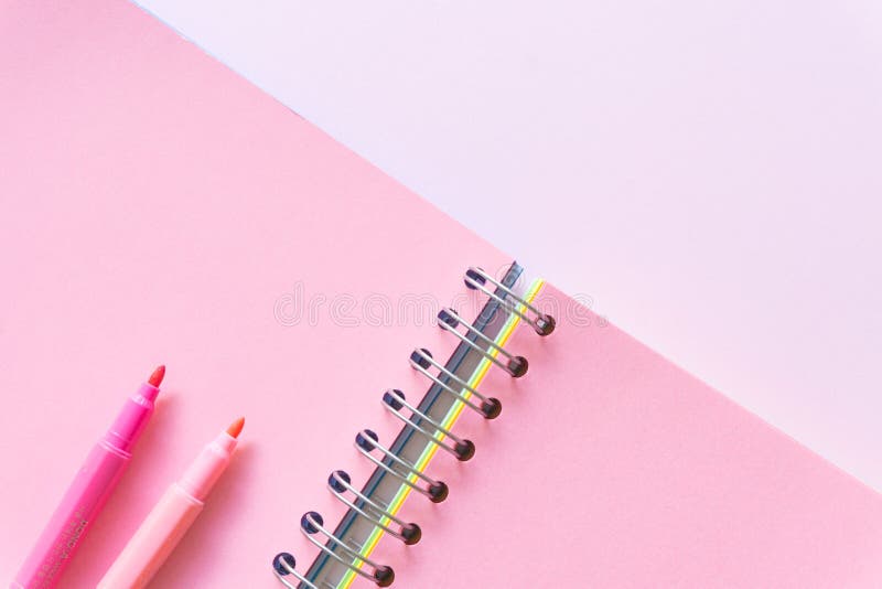 Flat lay of Notebook on pastel pink color background, minimal style. Work space. stock image Flat lay of Notebook on pastel pink color background, minimal style. Work space. stock image
