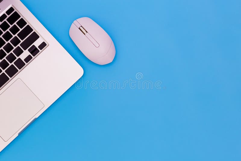 Flat lay Office desk table of modern workplace with laptop on blue table, top view laptop background and copy space on black royalty free stock image