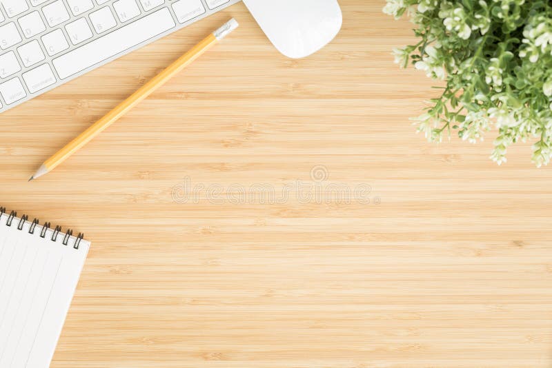 Flat lay photo of office desk with mouse and keyboard ,Top view workpace on bamboo wood table and copy space stock photos Flat lay photo of office desk with mouse and keyboard ,Top view workpace on bamboo wood table and copy space stock photos