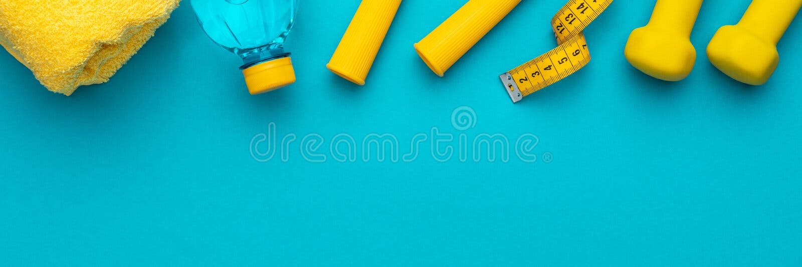 Top view of yellow soft measuring tape. Minimalist flat lay image