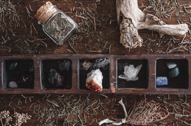 Flat lay shot of a collection of many different crystals on a messy wiccan witch`s altar royalty free stock photo
