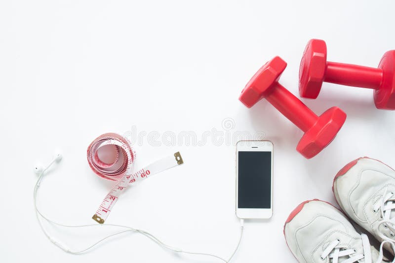 Flat lay of smartphone with measuring tape, red dumbbells stock photography Flat lay of smartphone with measuring tape, red dumbbells stock photography