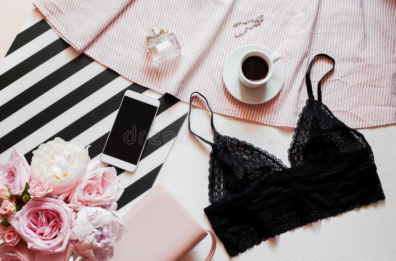 Flat lay. Top view black lace lingerie. Beauty blog concept. Bouquet of roses and pions, coffee on white background stock photo Flat lay. Top view black lace lingerie. Beauty blog concept. Bouquet of roses and pions, coffee on white background stock photo