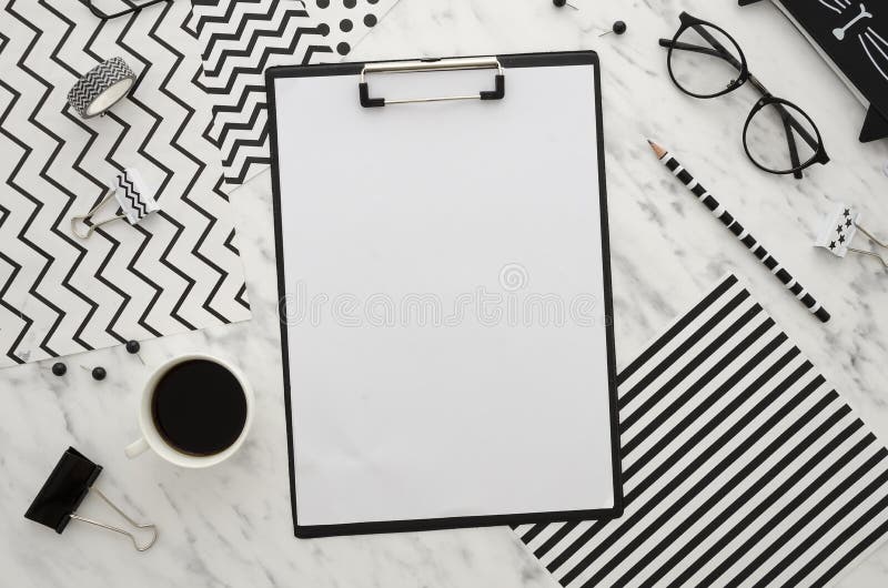 Home office desk workspace with blank clipboard and office accessories on white background. Abstract Diagonal Lines