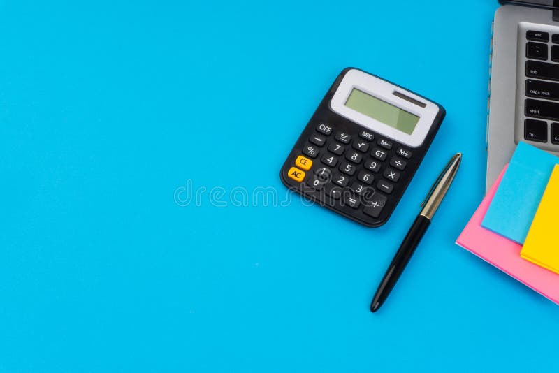 Workspace with Calculator, Black Pen, Laptop on the Turqoise Blue Background.  Stock Image - Image of calculator, accounting: 142374239