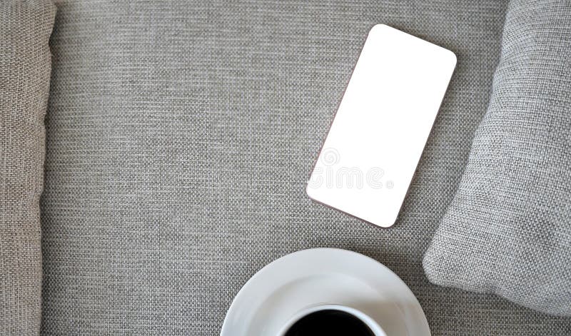 Flat Lay, Top view smartphone mockup with clipping path, with a cup of coffee with copy space, freelancer workplace or online stock photos