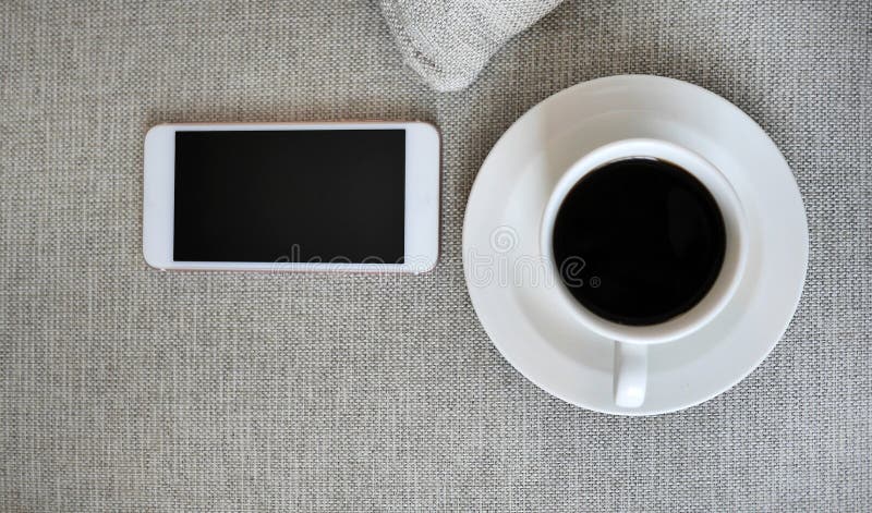 Flat Lay, Top view smartphone mockup and a cup of black coffee on fabric textile with copy space, digital NOMAD, freelancer stock photos