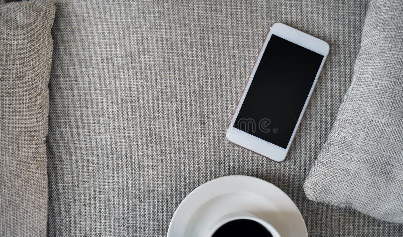 Flat Lay, Top view smartphone mockup and a cup of black coffee on fabric textile with copy space, digital NOMAD, freelancer stock photos
