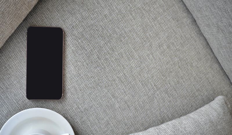 Flat Lay, Top view smartphone mockup and a cup of black coffee on fabric textile with copy space, digital NOMAD, freelancer royalty free stock photos