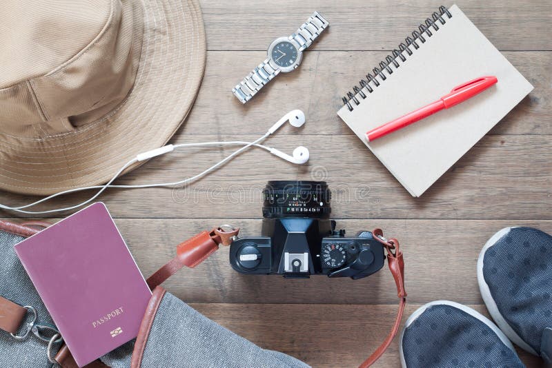 Flat lay of travel items and accessories with camera