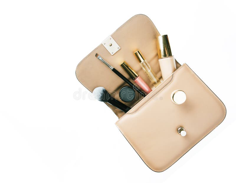 Flat lay of woman handbag accessories and cosmetics on white background. royalty free stock image Flat lay of woman handbag accessories and cosmetics on white background. royalty free stock image