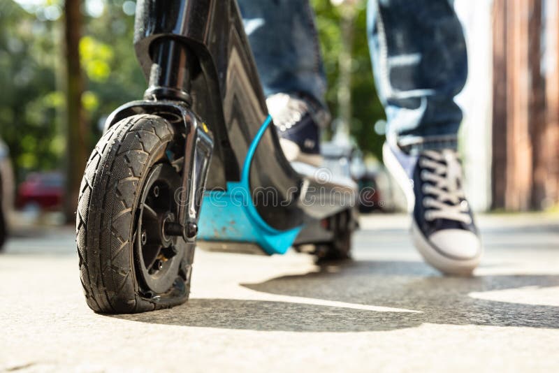 Flat Tire on EScooter stock image. Image of electricity 181835897