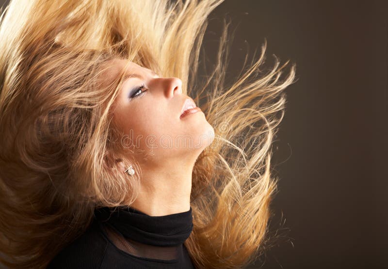 Fine long hair of the girl flutter in movement. Fine long hair of the girl flutter in movement