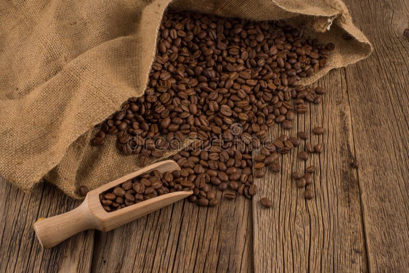 Flavor of coffee and wooden background