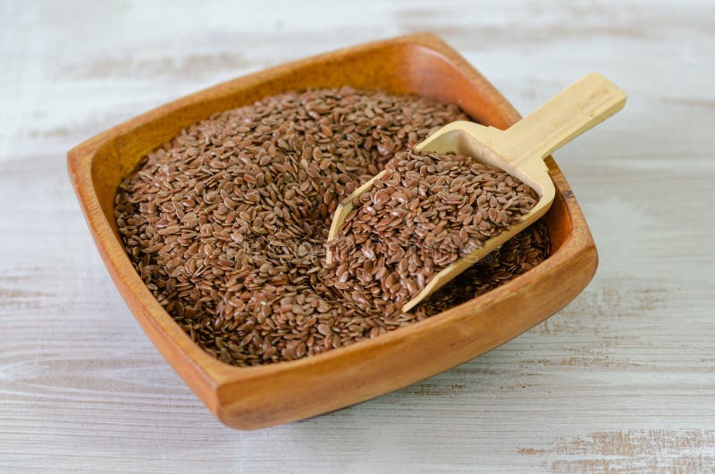 Flax seeds in wooden bowl royalty free stock photography Flax seeds in wooden bowl royalty free stock photography