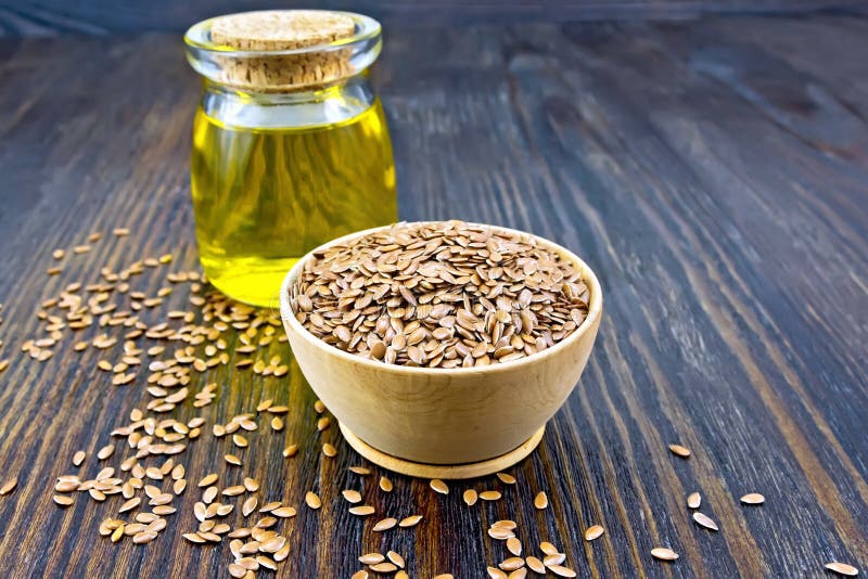 Flaxen Brown Seed in Bowl with Oil on Board Stock Image - Image of ...