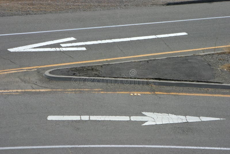 Painted road arrows pointing in the opposite direction. Painted road arrows pointing in the opposite direction.