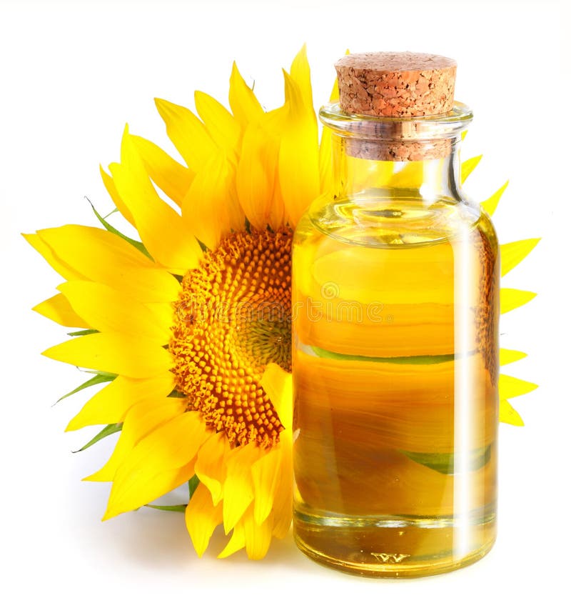 Fles zonnebloemolie met bloem. stock fotografie Fles zonnebloemolie met bloem. stock fotografie