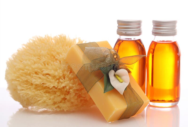 Bottles with essential oils and sponge isolated on white background. Bottles with essential oils and sponge isolated on white background