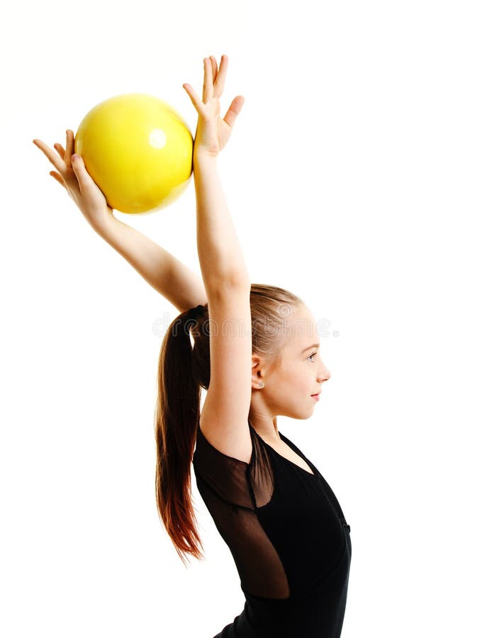Flexible cute little girl child gymnast doing acrobatic exercise with ball isolated on a white background