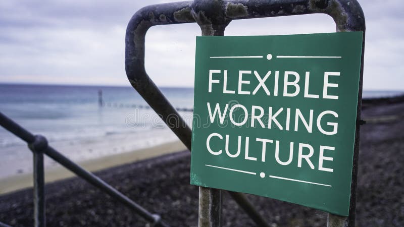 Flexible Working Culture sign in a beach setting stock image