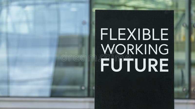 Flexible Working Future on a sign outside a modern glass office building royalty free stock photo