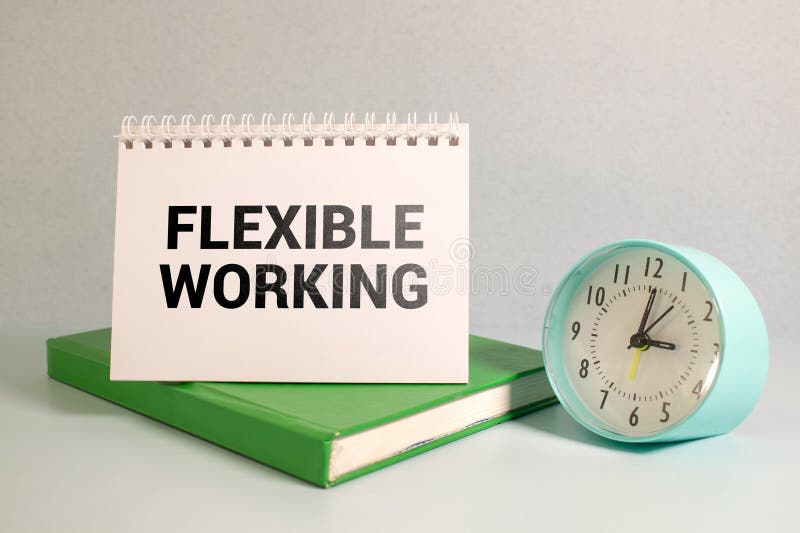 Flexible working policy concept. text on a torn page. red paper clip calculator stock photography