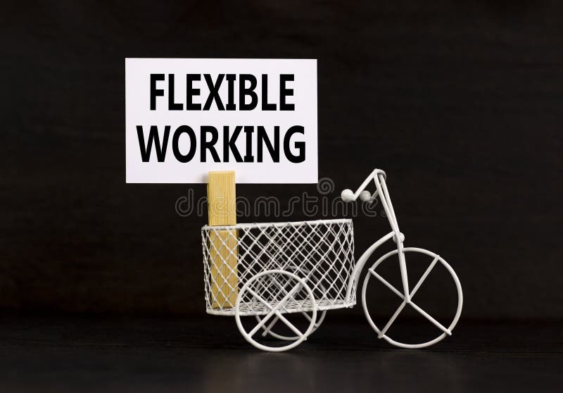 Flexible working symbol. Concept words Flexible working on beautiful white paper on wooden clothespin. Beautiful black background royalty free stock photo