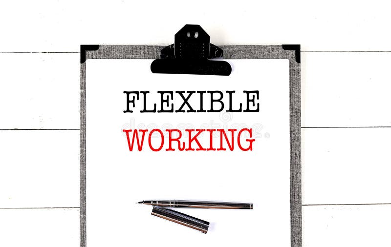 FLEXIBLE WORKING text on clipboard on white background royalty free stock photos