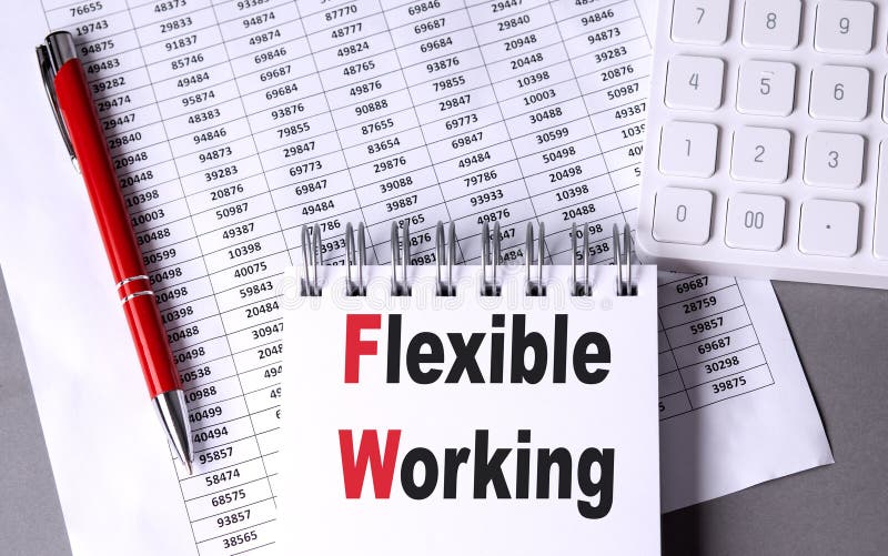 FLEXIBLE WORKING text on notebook with pen, calculator and chart on grey background royalty free stock photo