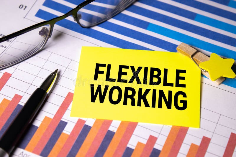 FLEXIBLE WORKING text in the office notebook with office tools, business stock images