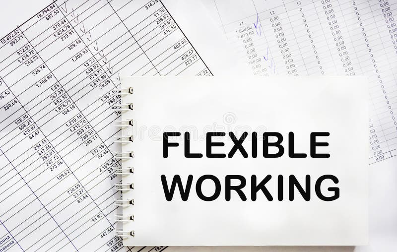 FLEXIBLE WORKING text in office notepad with documents, business royalty free stock image