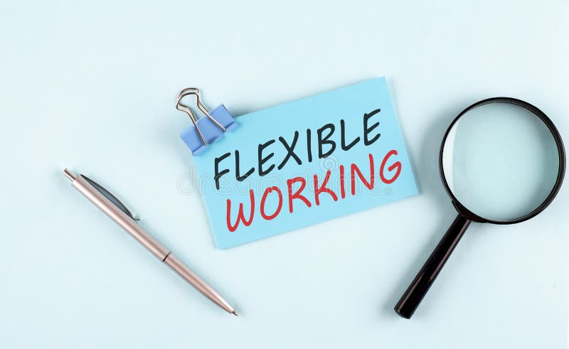FLEXIBLE WORKING text written on a sticky with magnifier and pen, business concept stock images